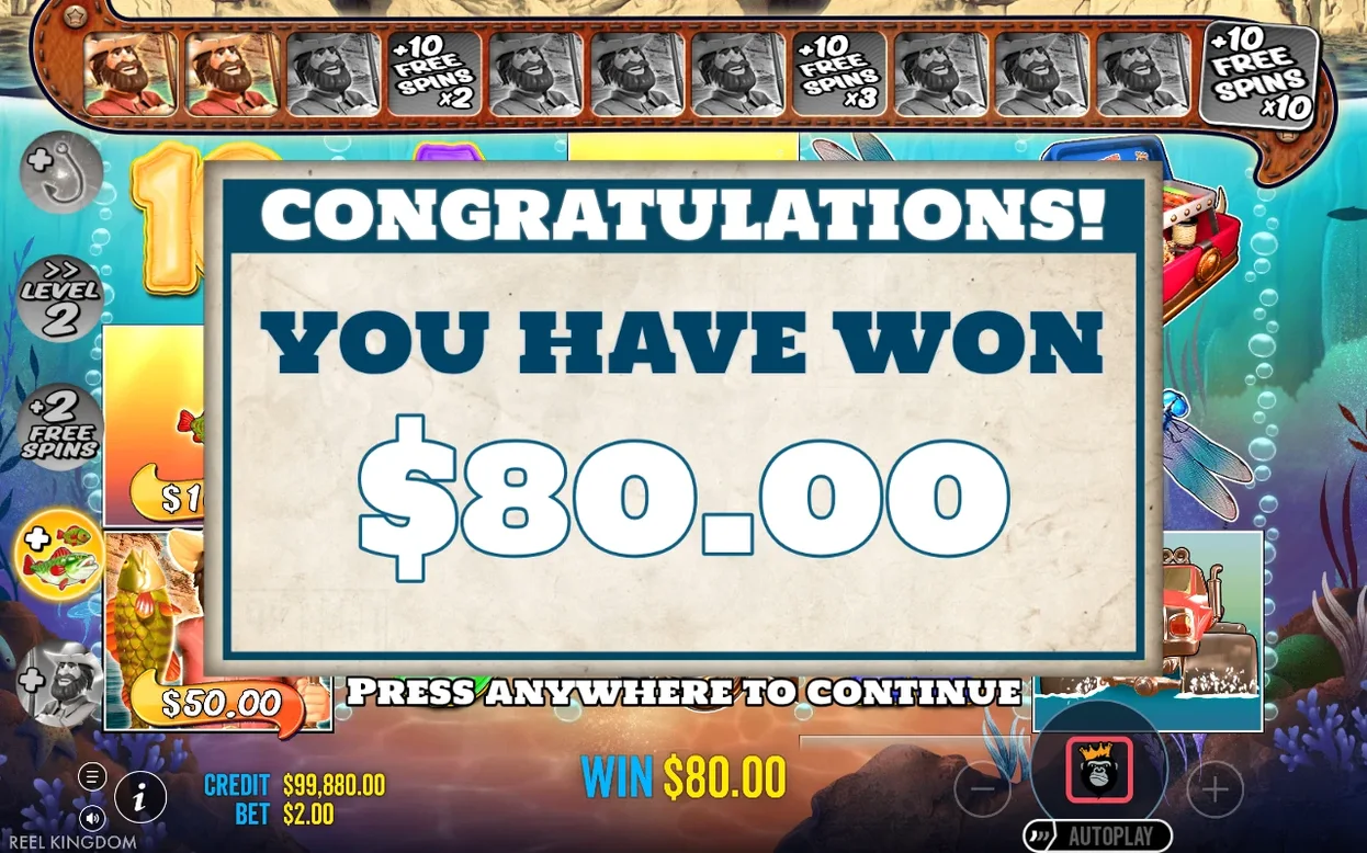 Popup de fin de tours gratuits : « YOU HAVE WON $80.00 », jauge du pêcheur en haut, crédit 99 880 $.